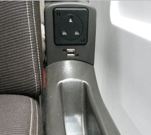 [Eurostar]The new Eurostar e320 trains have the power sockets (which include USB sockets) hidden discretely under arm rests rather than on the wall like the older e300 trains