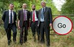 East West Rail is GO! as VIPs (including MP and DfT representative) stand in front of 'GO' (rather than 'Stop') sign on the mothballed route east of Claydon Junction. This photo was taken after they alighted from a Chiltern Railways special train to promote the reopening
