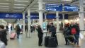 [Eurostar]The concourse leading to the Eurostar check-in is spacious most of the time (hence the slightly blurred images of people whizzing past) but when serious disruption occurs the queues can continue out onto the adjacent street.