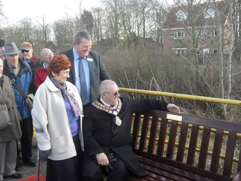 PHO:Sue, Pete and Mayor looking at Brian Hastings bench inscription